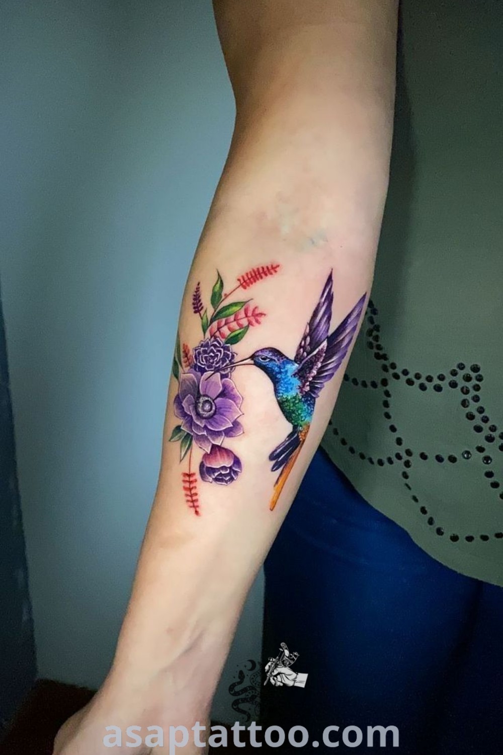 Colorful hummingbird tattoo depicting vivid design with elegance and artistic flair. A perfect choice for those exploring amazing tattoo ideas you
