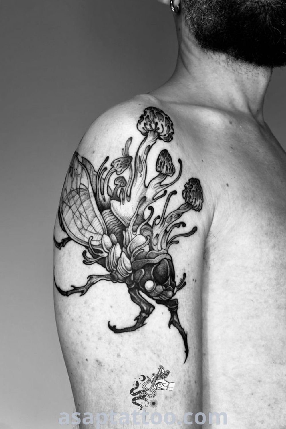 Black detailed cicada tattoo showcasing intricate design elements, ideal for those seeking bug tattoos for men and creative insect tattoo sleeve inspiration. Discover the amazing aesthetic at asaptattoo.com.
