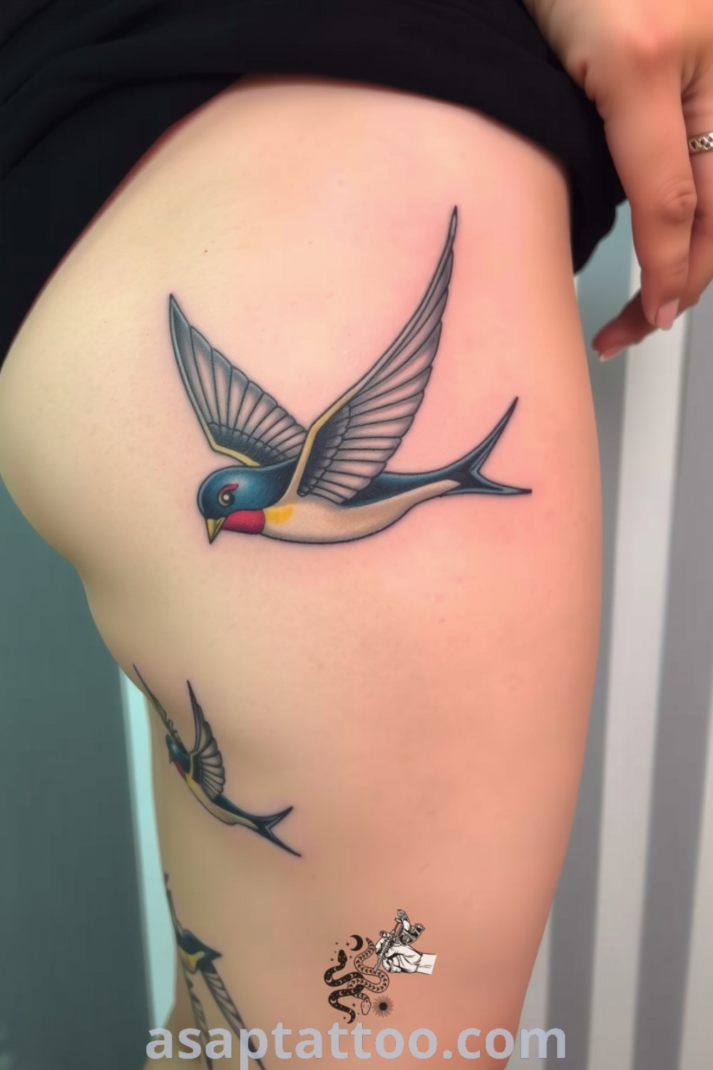 Tattoo of a swallow in flight with intricate linework and rich colors. A gorgeous tattoo idea that captures the essence of freedom and adventure, perfect for anyone seeking inspiring body art. asaptattoo.com