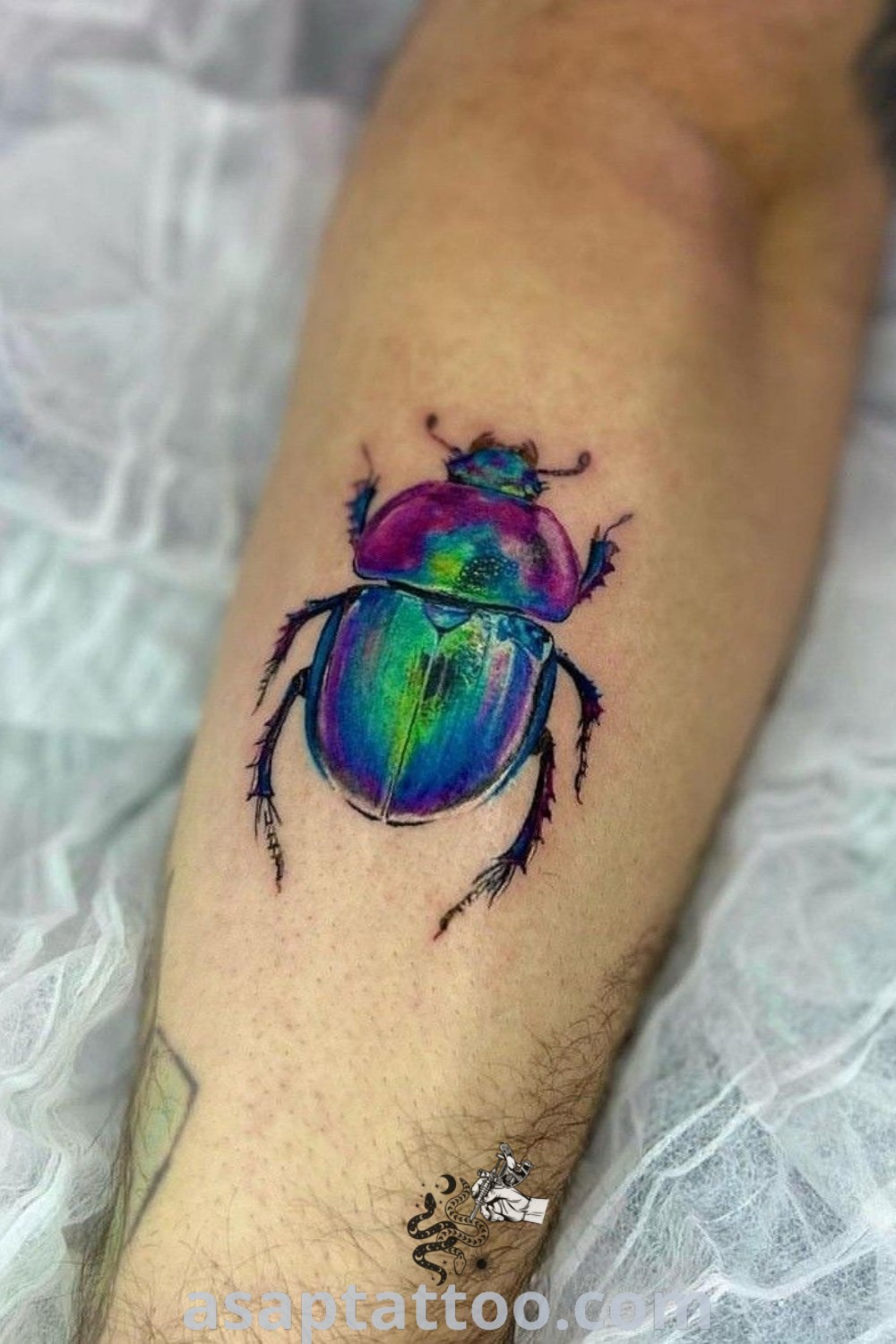 Colorful beetle tattoo on forearm and leg featuring vibrant hues, neotraditional design, perfect for nature lovers seeking inspiring tattoos to melt your heart. Explore best tattoo ideas at asaptattoo.com.