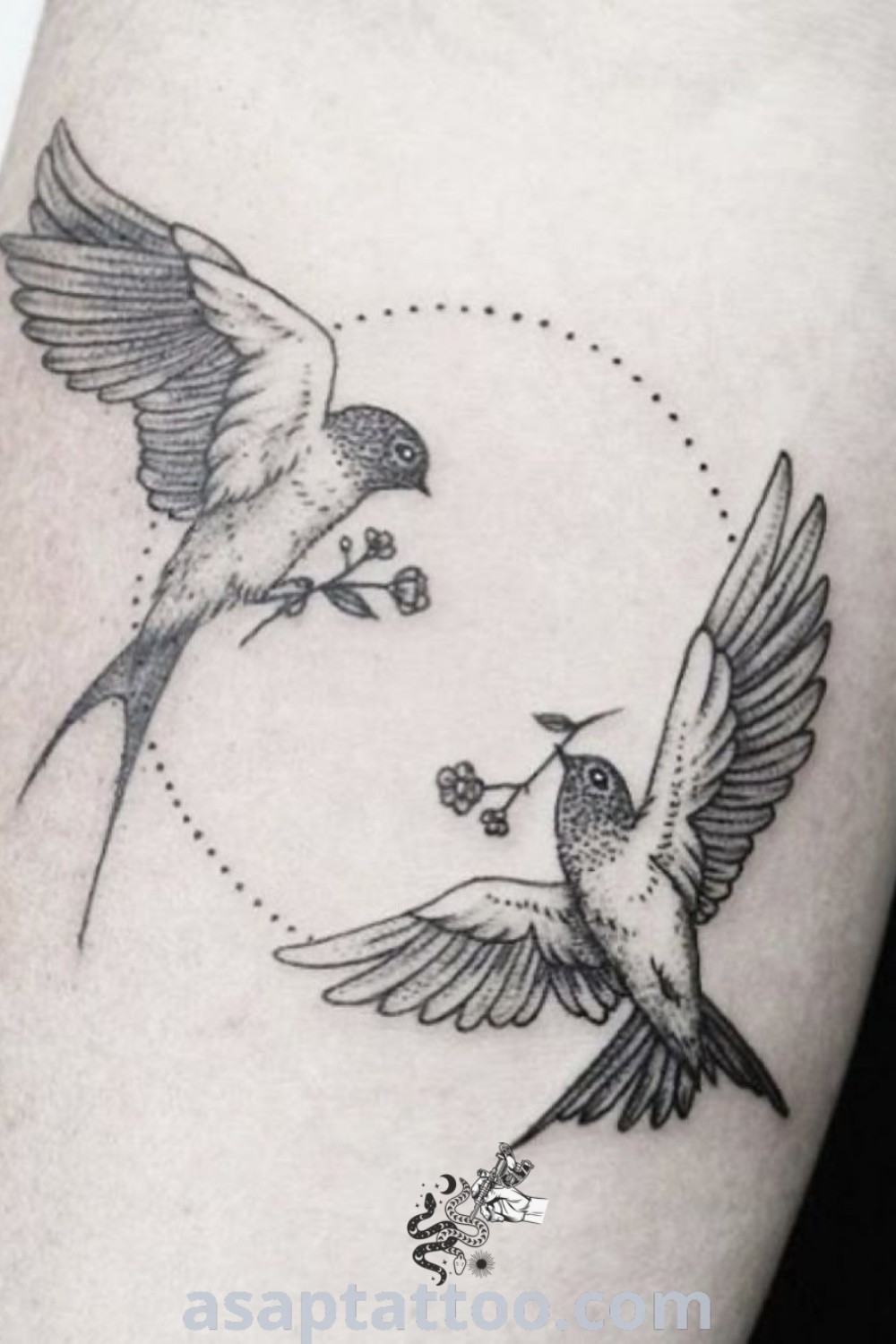 Elegant swallow bird tattoo featuring a couple of birds flying together on a woman