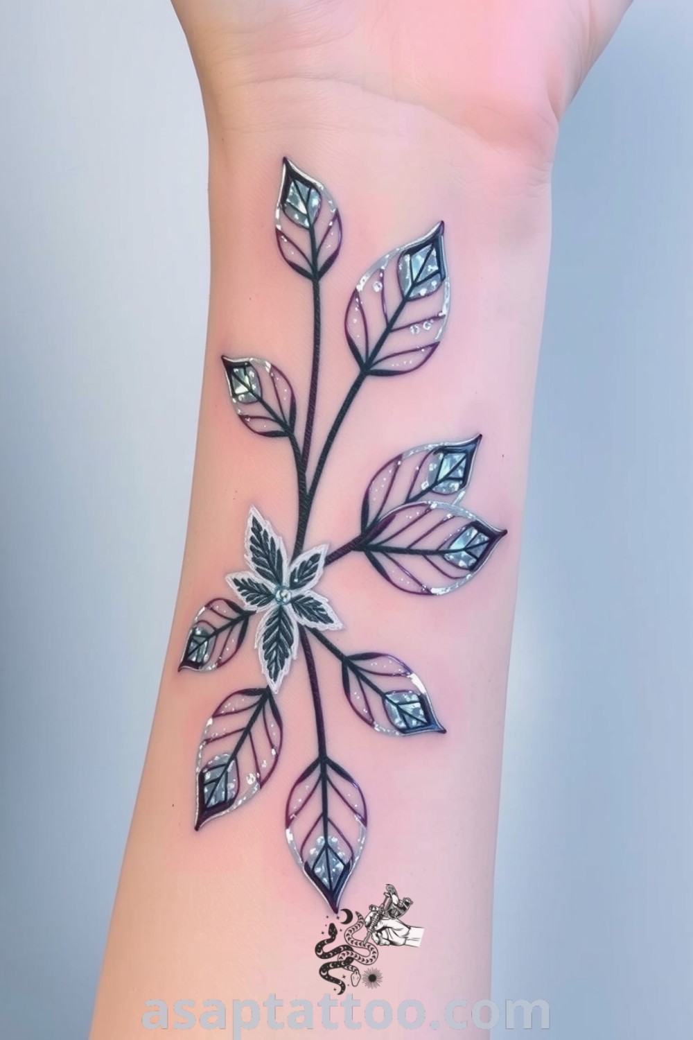 Ice-themed plant tattoo featuring frosted leaves with delicate gradients and crystalline details. A gorgeous and elegant tattoo idea that you will absolutely love. asaptattoo.com
