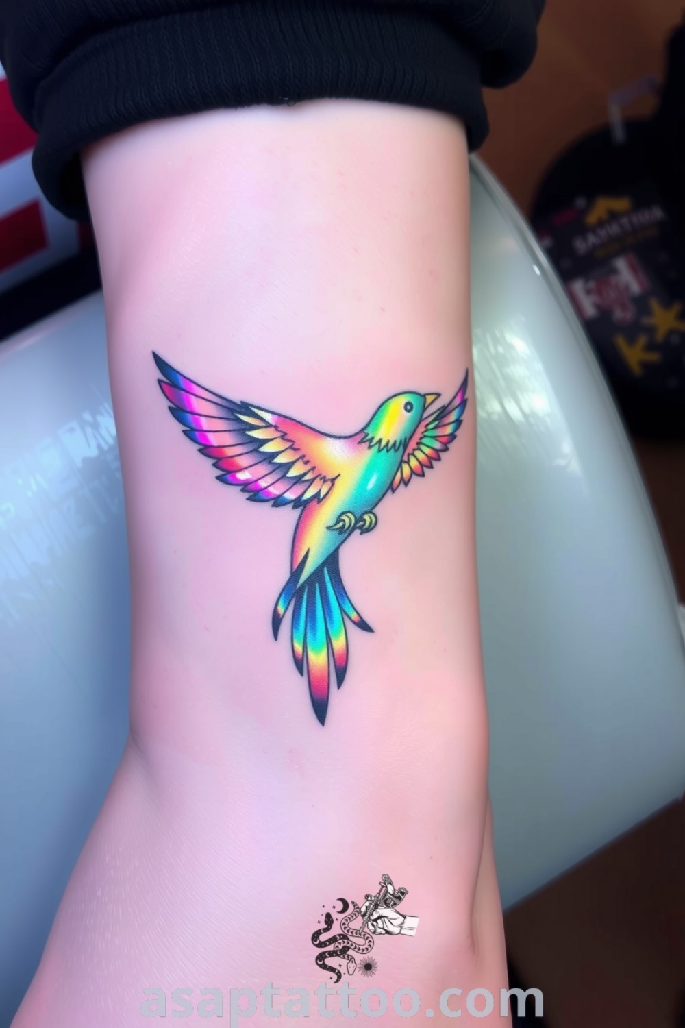 Holographic bird tattoo with intricate linework and vibrant colors, showcasing ethereal elegance and grace. A gorgeous tattoo idea you must see to believe. asaptattoo.com