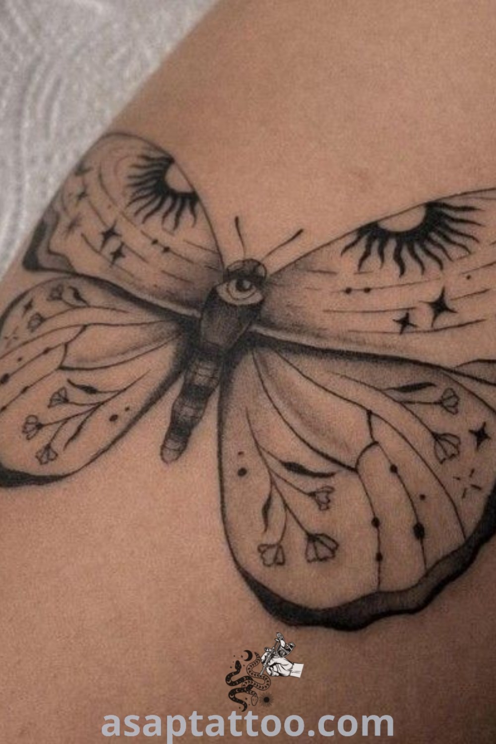 Elegant black and white butterfly tattoo on a woman