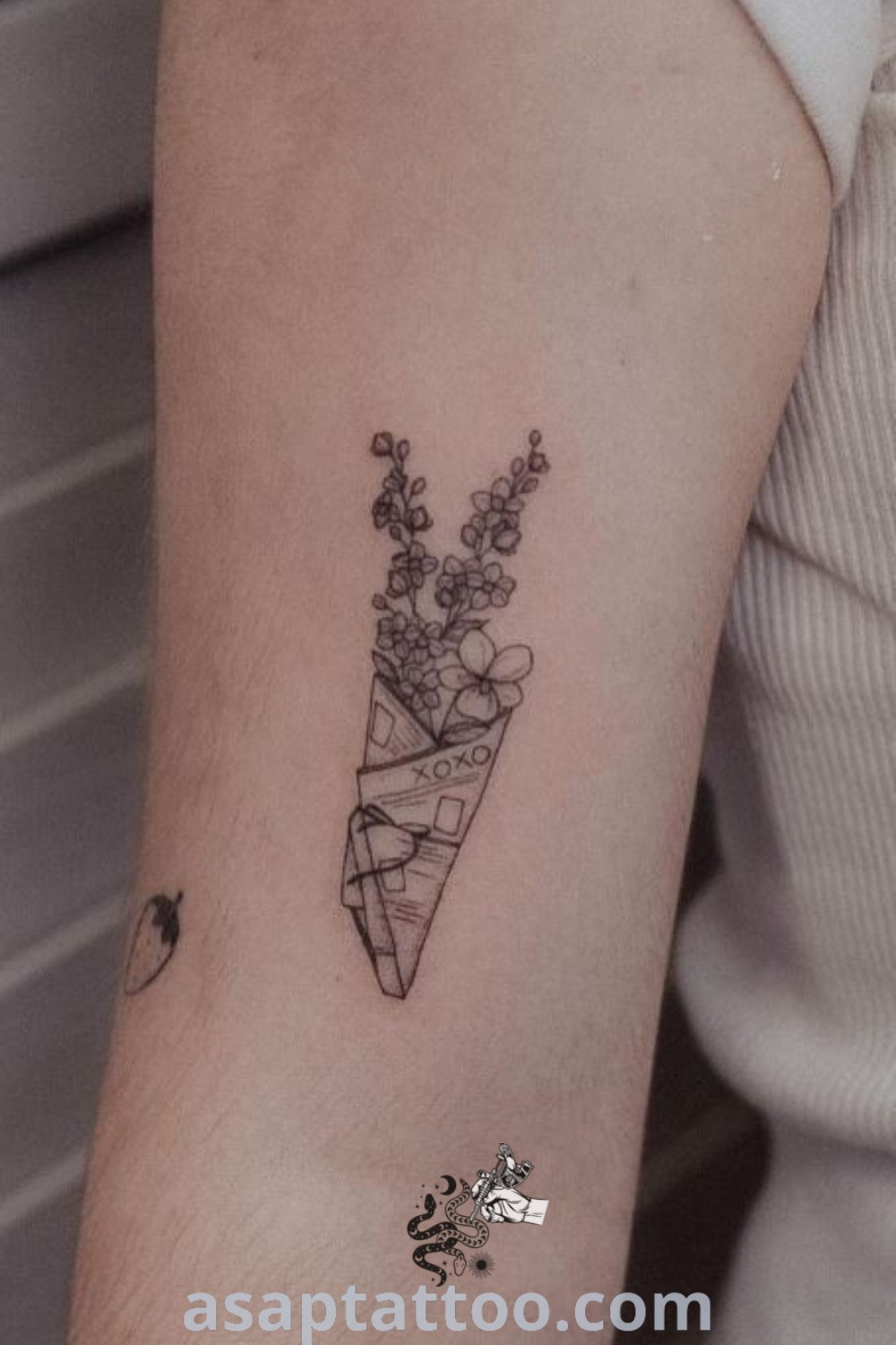 Elegant floral triangle tattoo on a woman
