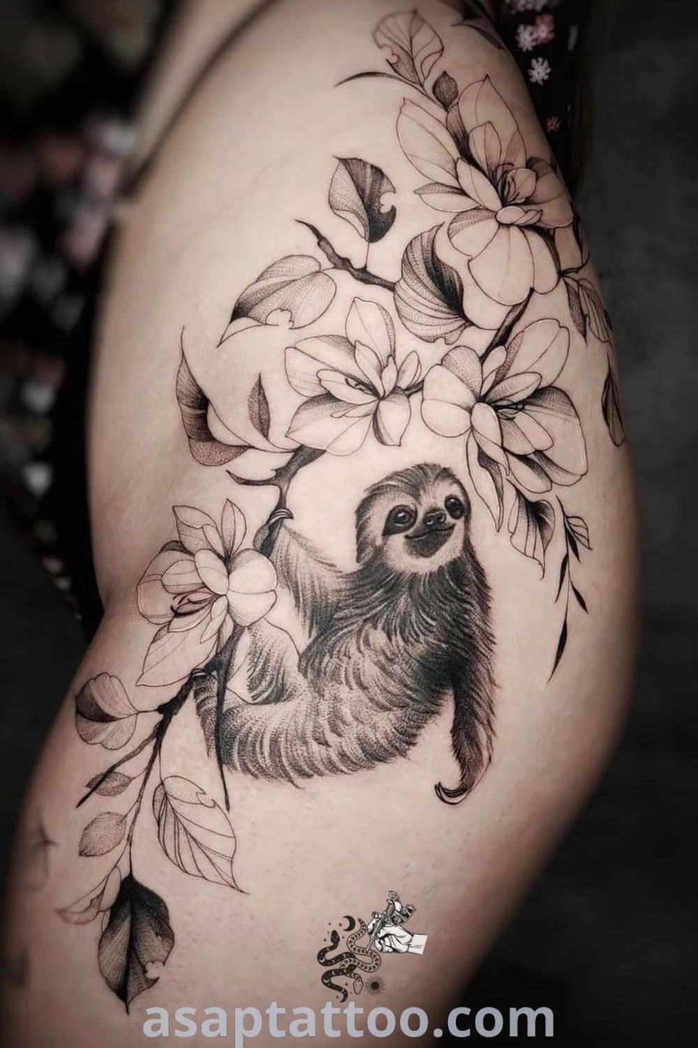 Cute sloth tattoo on the thigh adorned with leaves and flowers, showcasing an amazing animal floral design. Perfect for inspiration on sloth tattoos for women, explore more at asaptattoo.com.