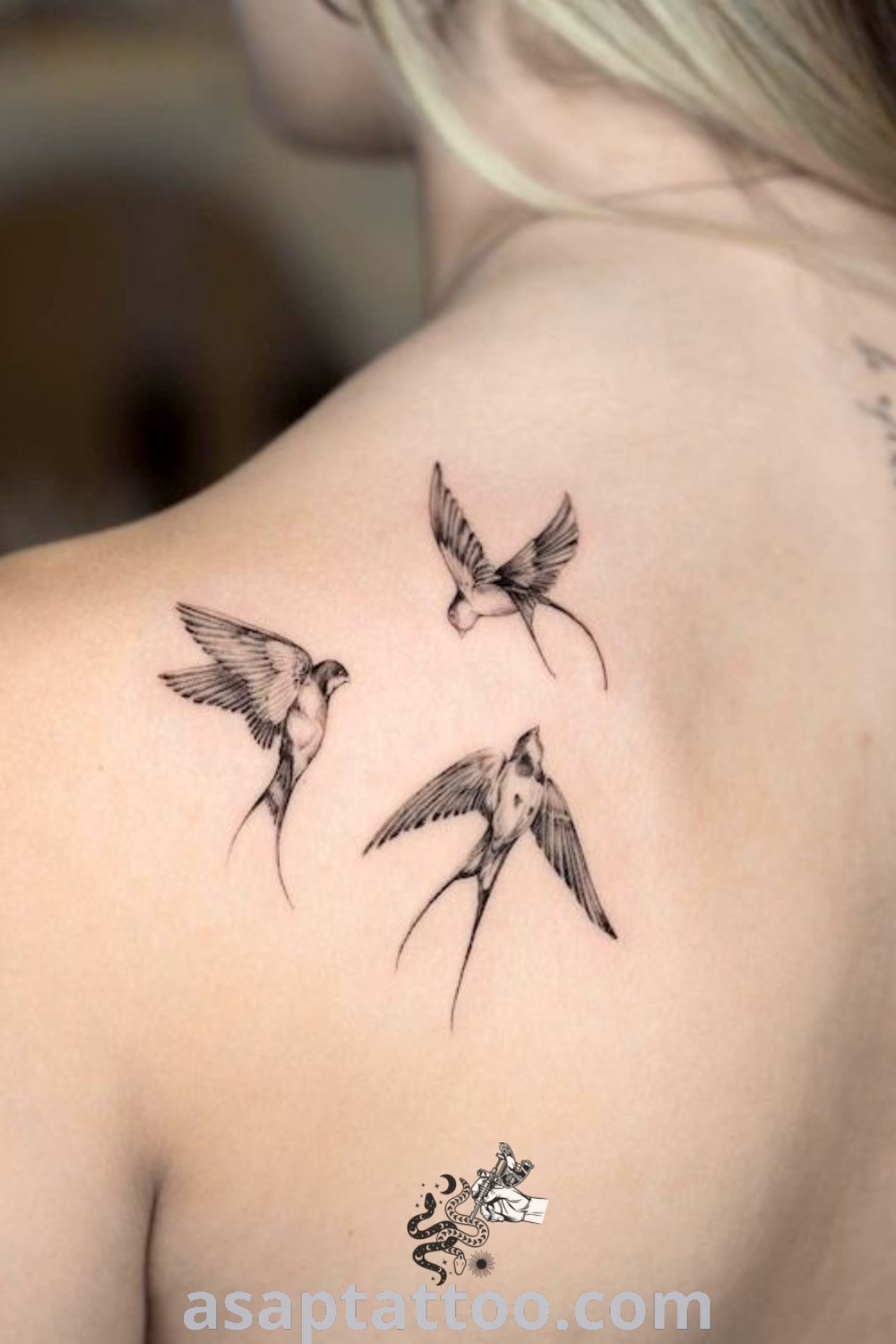 Delicate upper back tattoo of a woman