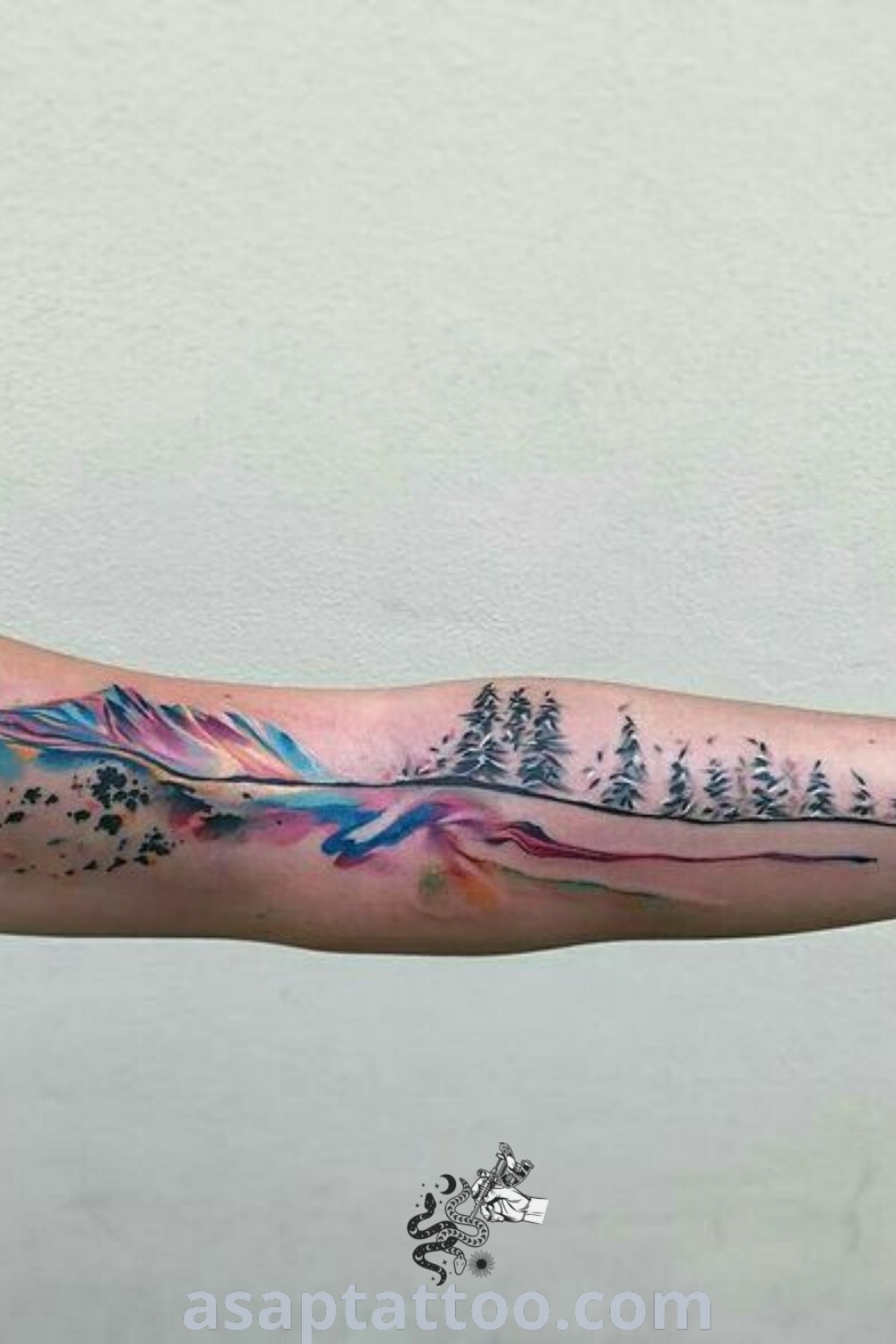 Adirondack tattoo featuring watercolor mountains and northern lights, perfect for nature lovers. An inspiring design that reflects Mother Nature