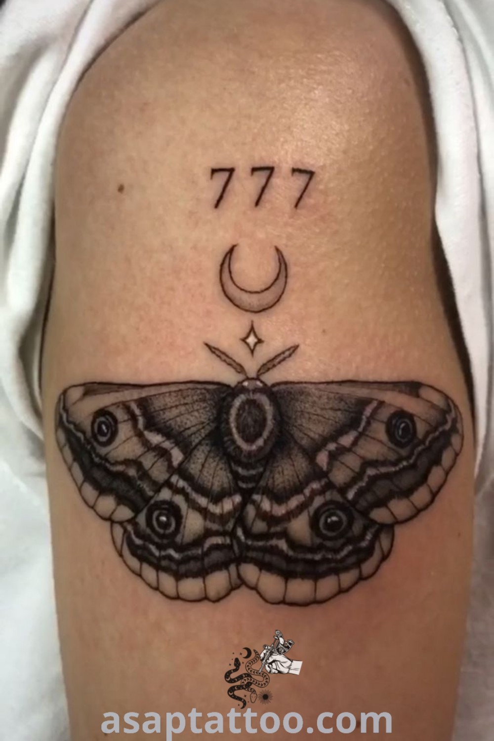 Black and white moth tattoo on right arm with crescent moon, showcasing geometric design elements. A stunning piece for those seeking inspiring tattoo ideas with meaning. Discover more at asaptattoo.com.