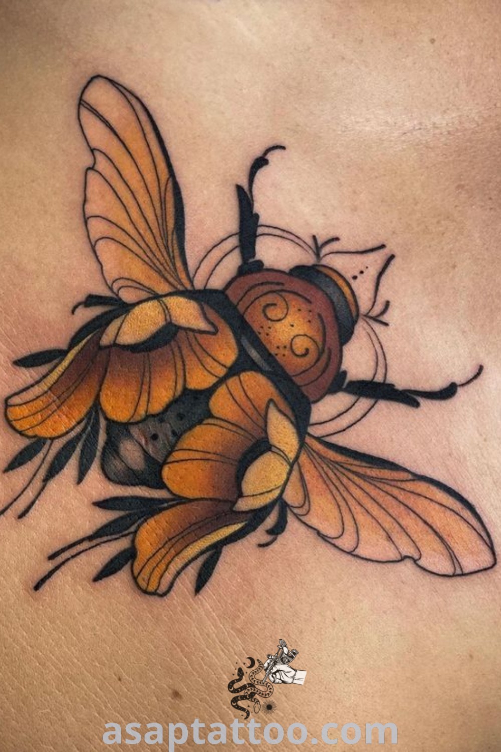 Elegant bee tattoo on a woman