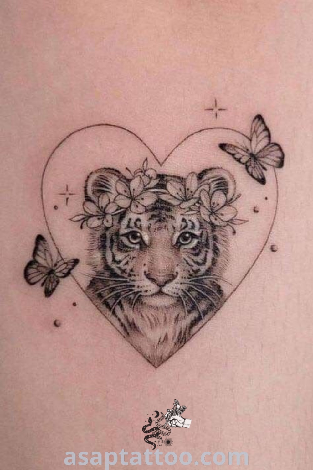 Heart-shaped tattoo with a tiger at the center and butterflies on the sides, showcasing cute animal tattoos with artistic and elegant features. Discover more inspiring tattoo ideas at asaptattoo.com.