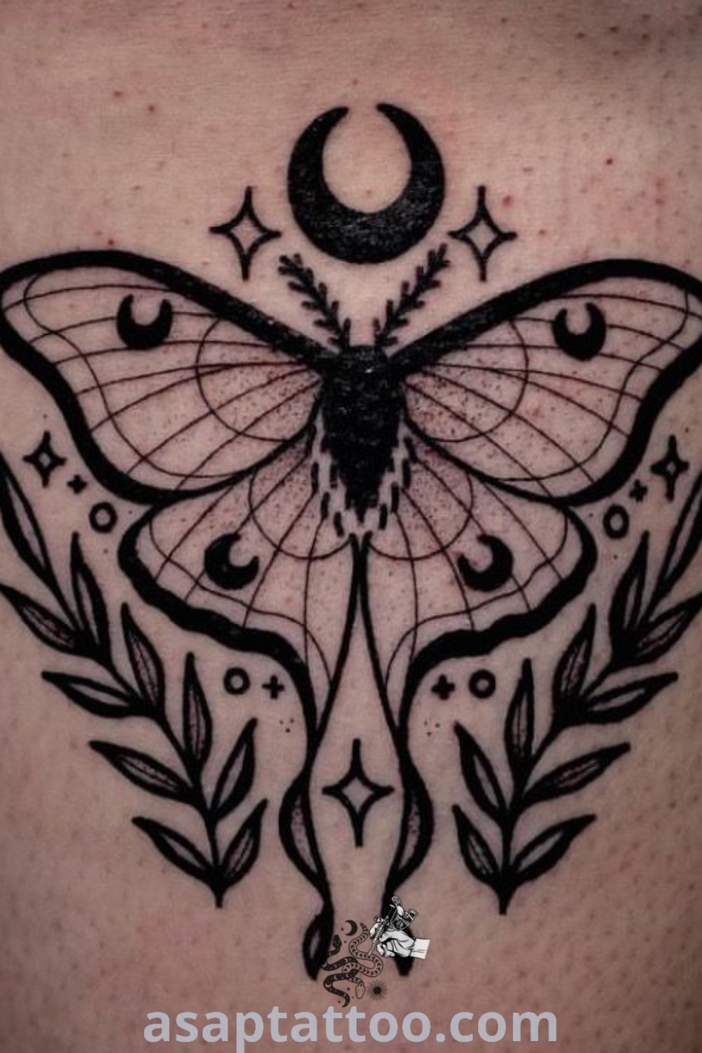 Black and white photo of a lunar moth tattoo with crescent details, representing elegant and meaningful body art. Perfect for those seeking cute and gorgeous designs. Discover amazing tattoo ideas at asaptattoo.com.