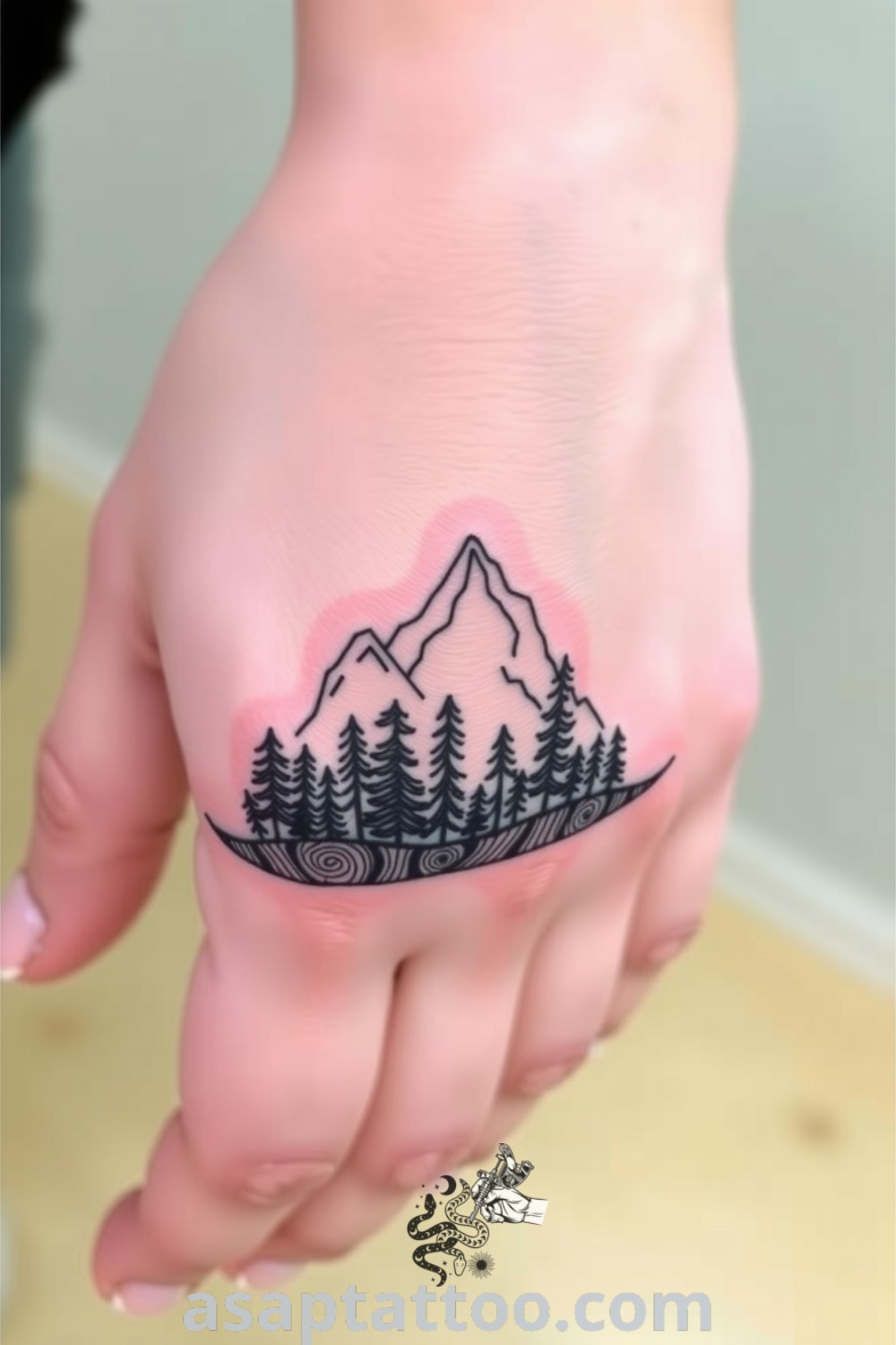 Intricate linework tattoo featuring mountains and a serene forest, expertly designed to celebrate nature