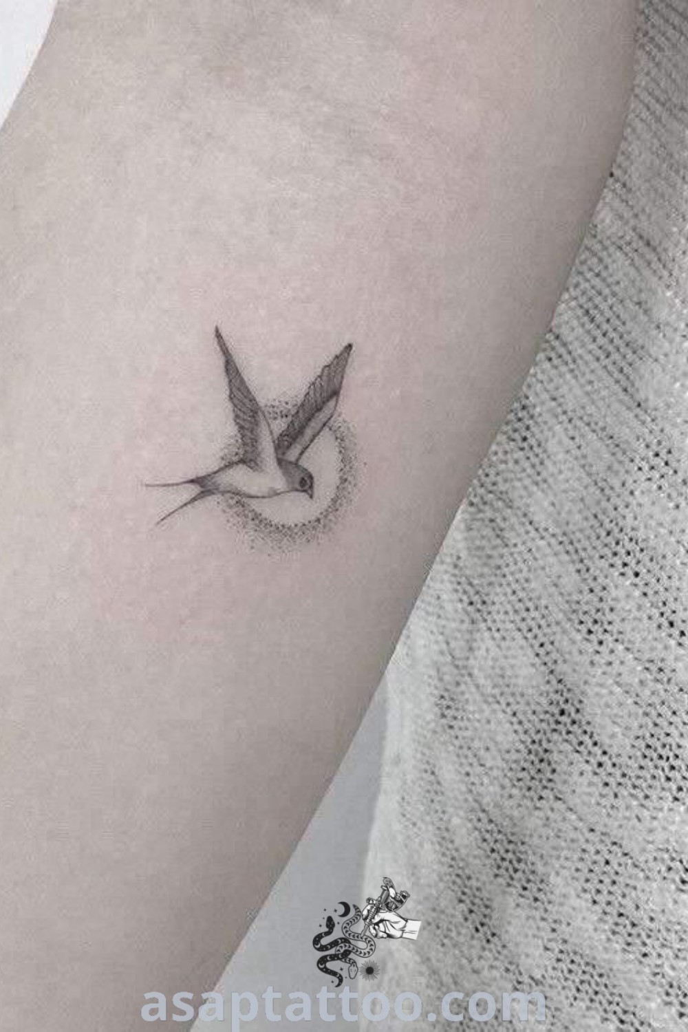 Elegant mockingbird tattoo on the arm, a minimalist design perfect for those who love bird tattoos. This aesthetic piece is among the best tattoo ideas you must see, inspiring body art from asaptattoo.com.