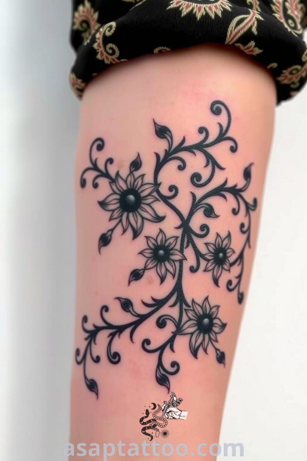 Intricate Baroque plants tattoo featuring ornate vines and decorative swirls on forearm, showcasing rich dark ink and elegant design. An amazing tattoo idea that will inspire you to get inked. asaptattoo.com