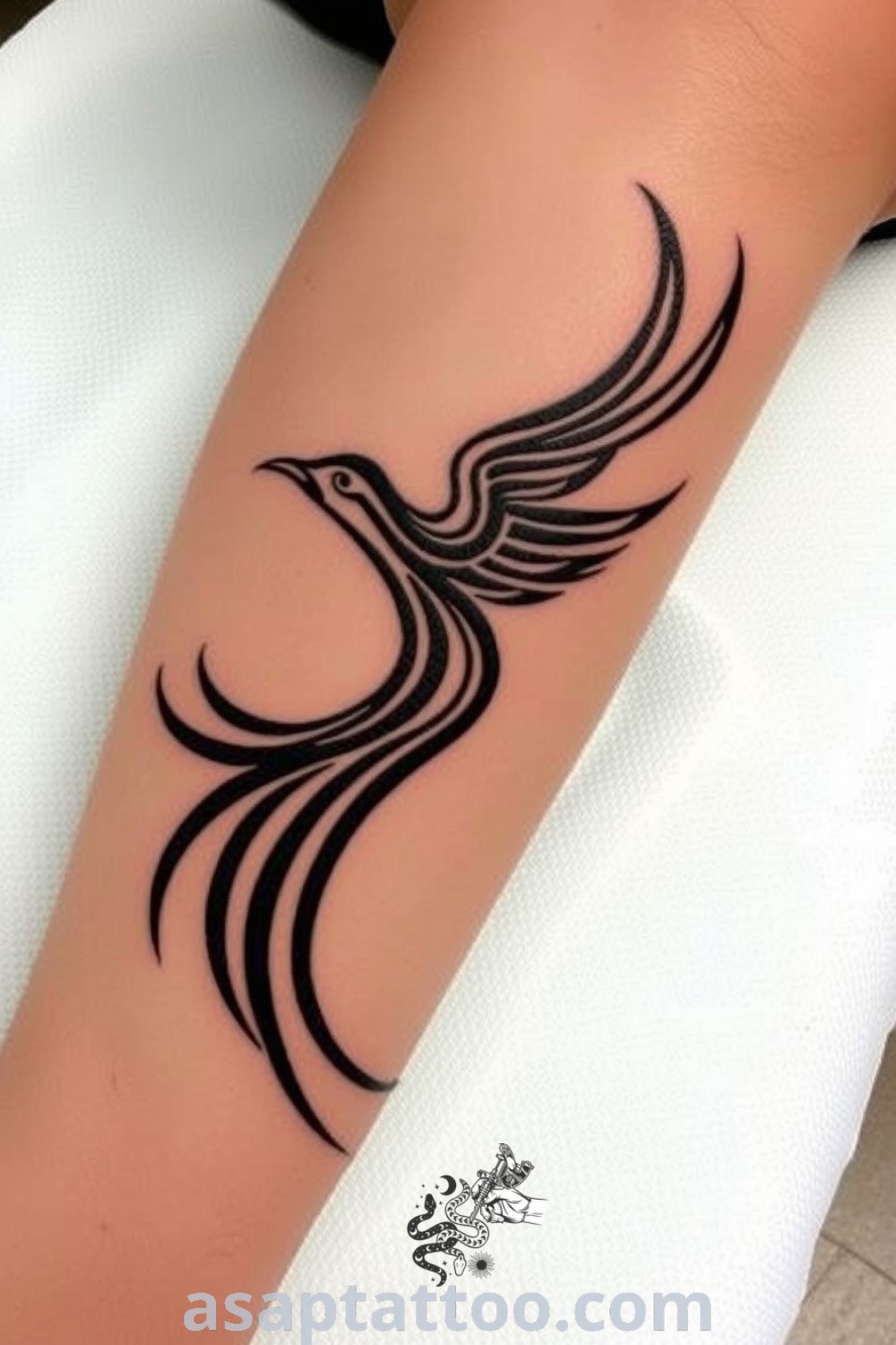 Tribal bird tattoo on the calf featuring intricate linework and bold black ink, showcasing movement and depth. A gorgeous tattoo idea that you must see for personal expression. asaptattoo.com