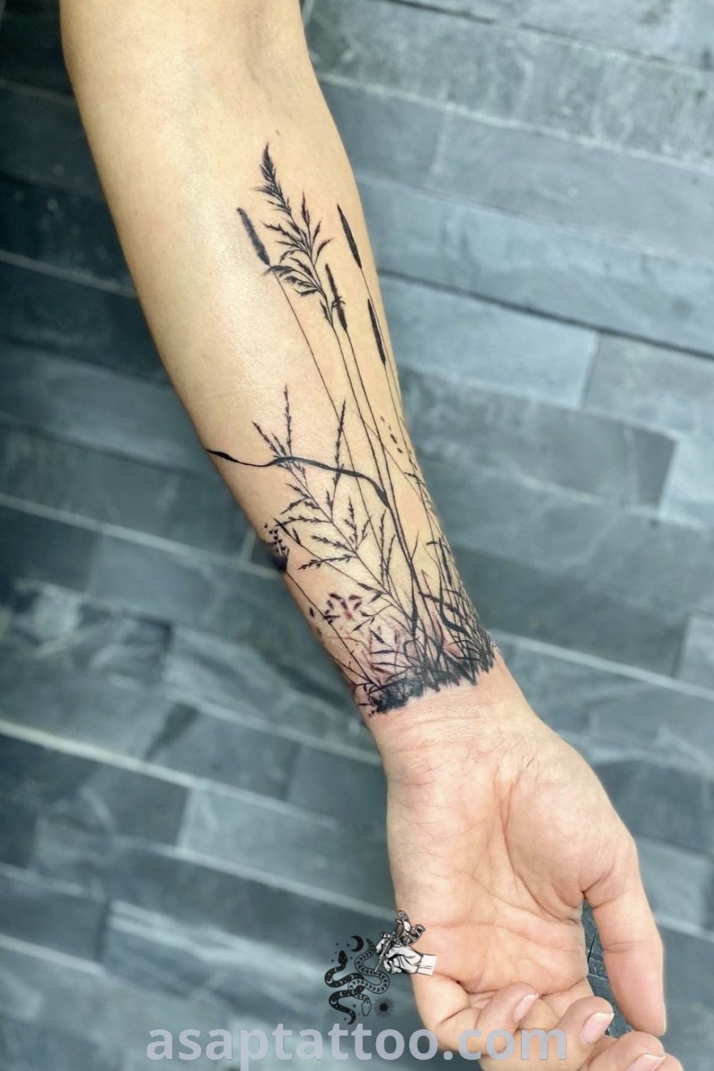 Elegant floral wrist cuff tattoo featuring white ink botanical designs. A gorgeous idea to inspire your next tattoo, showcasing nature