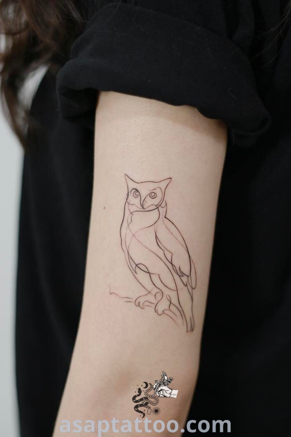 Small owl tattoo on left forearm with black outline, perfect for cute owl tattoo ideas. An elegant choice for those looking for mother tattoos, inspiring tattoo art to reflect personal meaning. Explore more at asaptattoo.com.