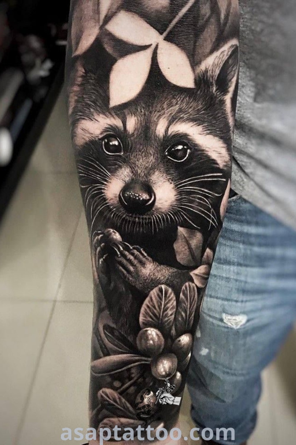 A detailed raccoon tattoo on a man