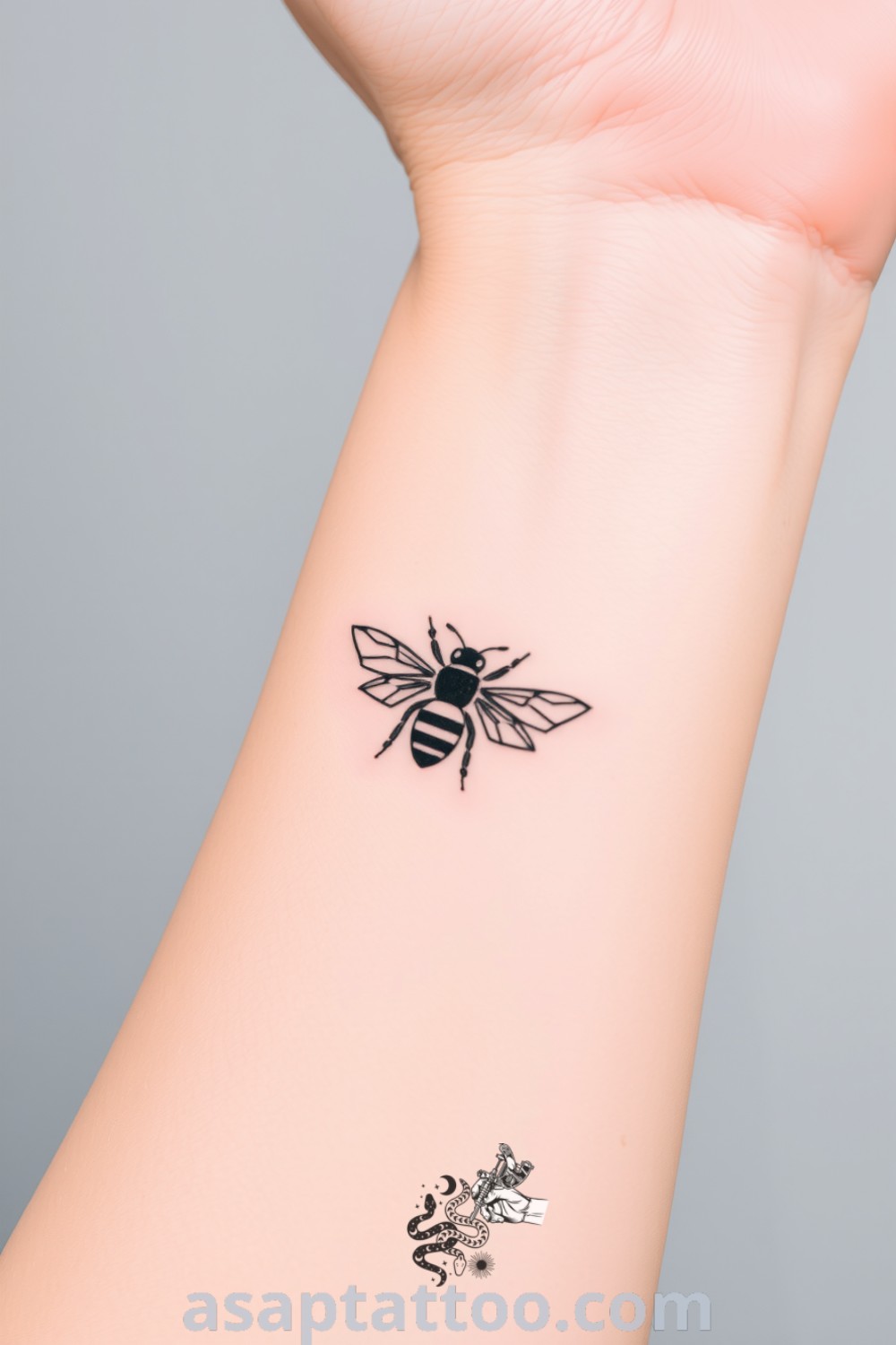 Minimalist bee tattoo with simple black lines and subtle gradients, beautifully blending art and skin. A gorgeous tattoo idea that embodies hard work and community, you will absolutely love. asaptattoo.com