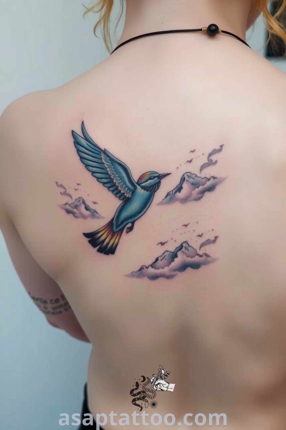 Surreal bird tattoo featuring intricate linework and vibrant colors, soaring amidst dreamy clouds. A gorgeous tattoo idea you will absolutely love. asaptattoo.com